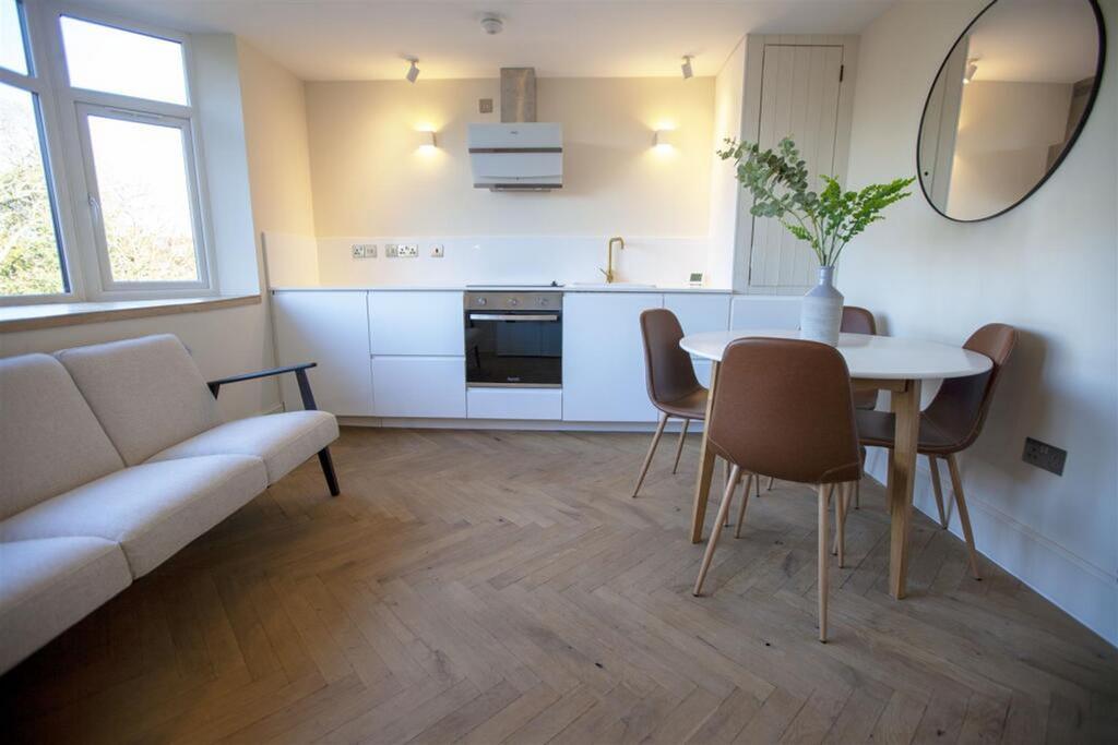 A stylish and modern kitchen featuring sleek ca...