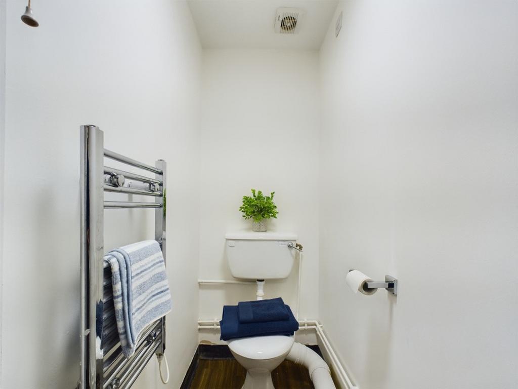 A clean and bright single toilet, well-maintain...