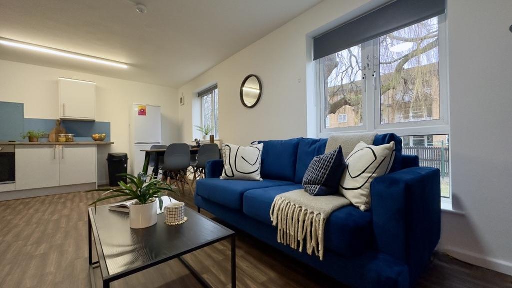 A spacious and inviting modern living room with...