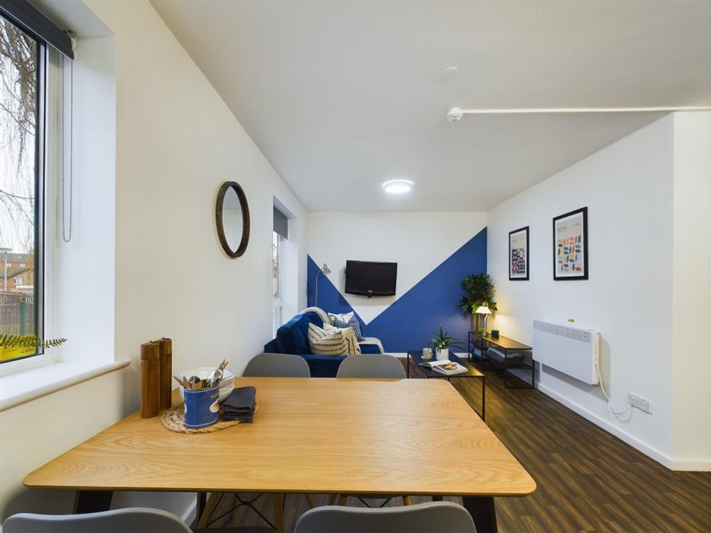 A spacious and inviting modern living room, per...