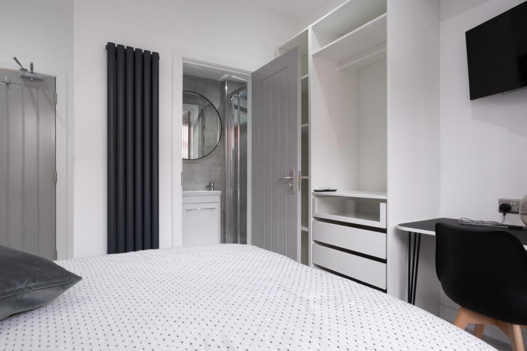A modern and stylish double bedroom with ample ...