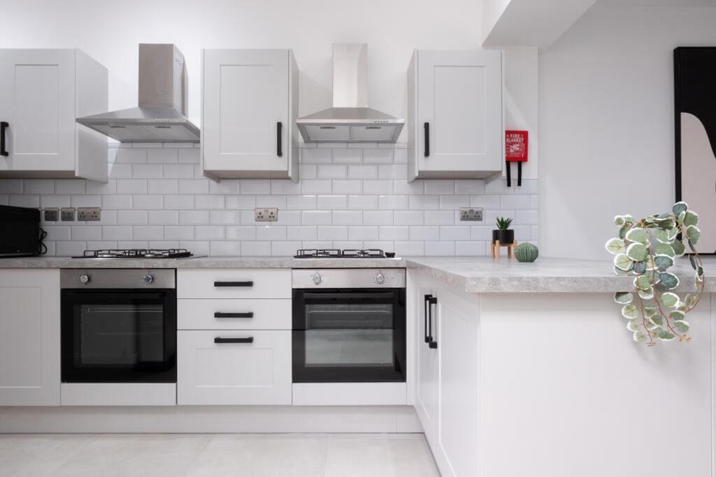 A modern and clean kitchenette with sleek desig...