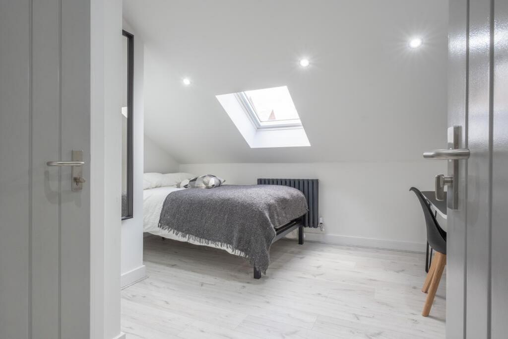 A spacious and inviting double bedroom with exc...