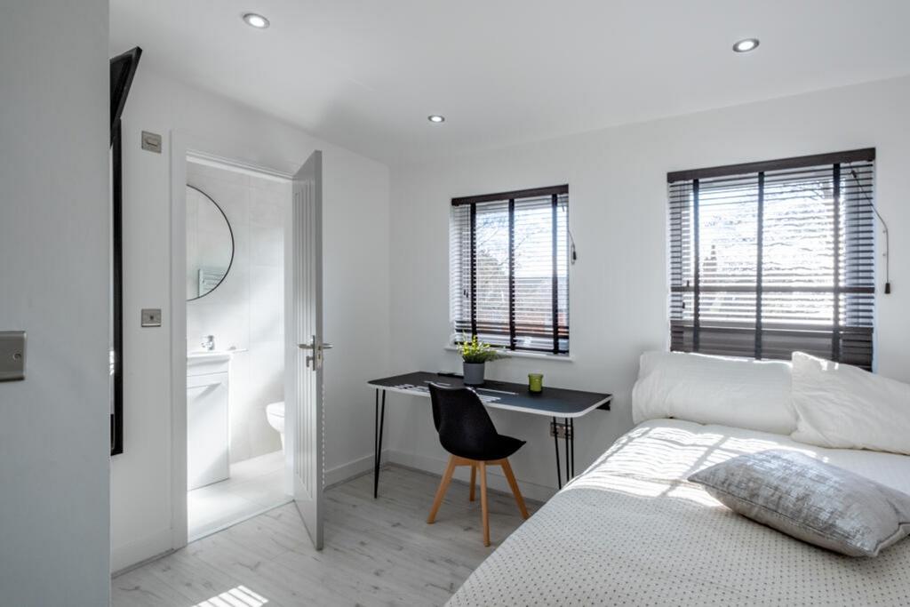 A bright and inviting double bedroom featuring ...
