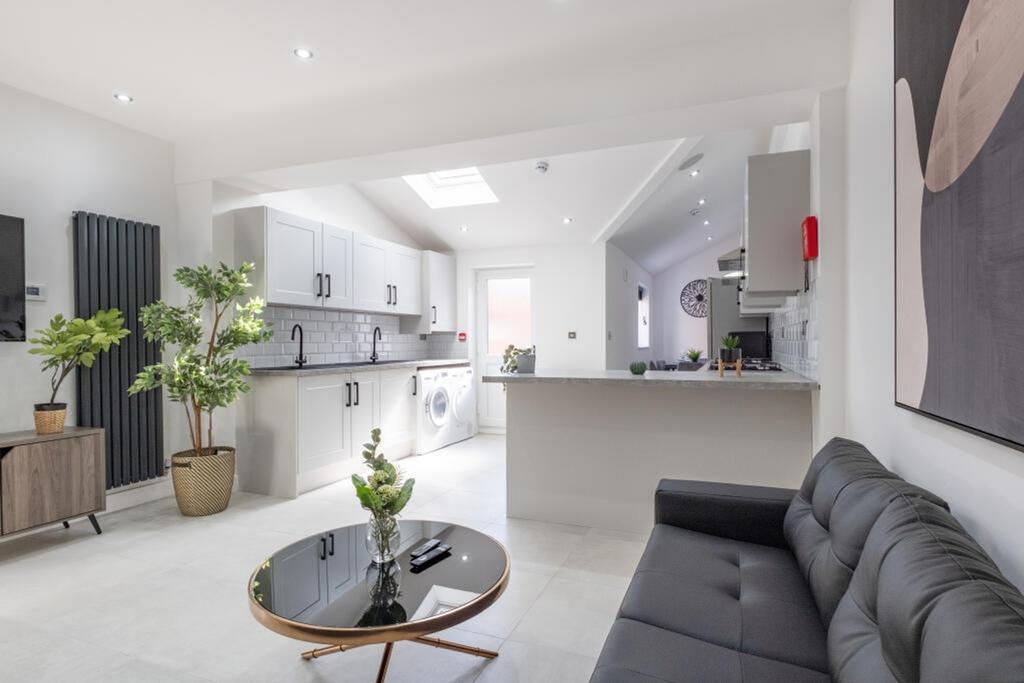 A bright and modern kitchenette with stylish de...