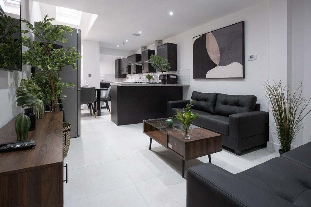 A contemporary living room featuring sleek furn...