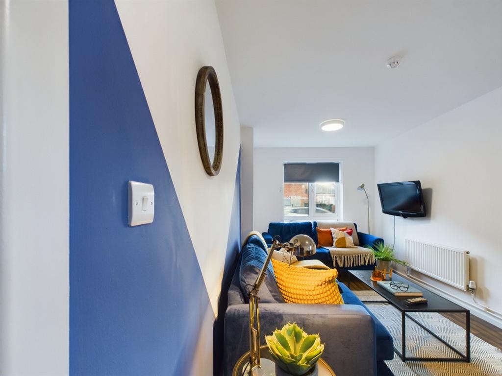 A bright and spacious modern living room, perfe...