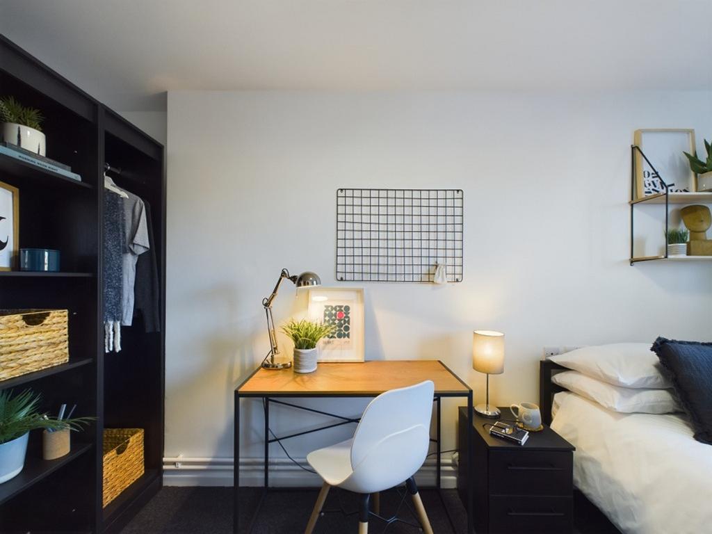 A stylish and organized double bedroom featurin...