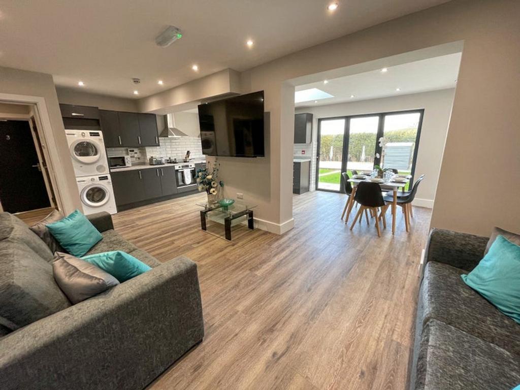 A stylish and spacious living room with modern ...