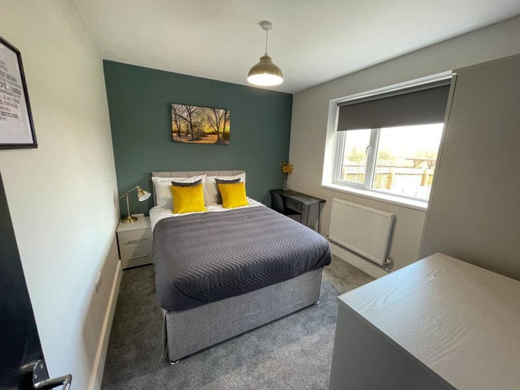 This charming double bedroom features a cozy at...