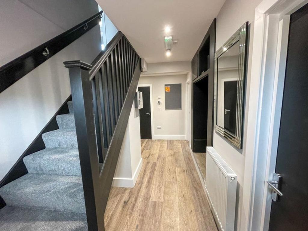 This inviting hallway features modern decor and...