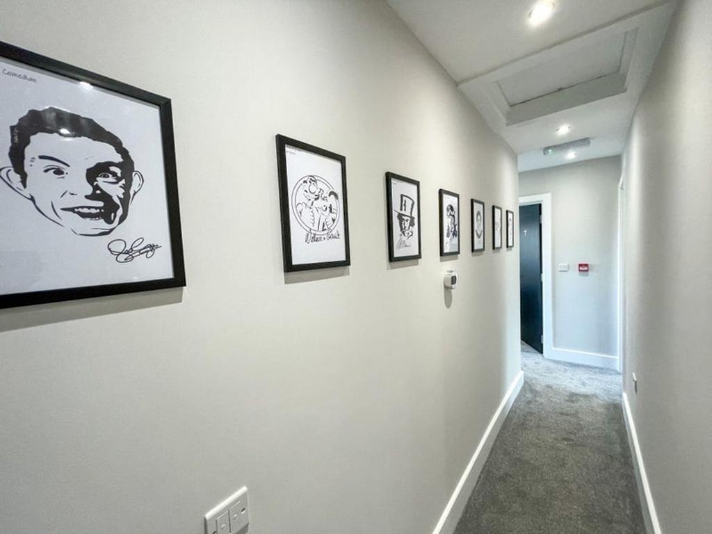 A well-maintained hallway featuring artistic fr...