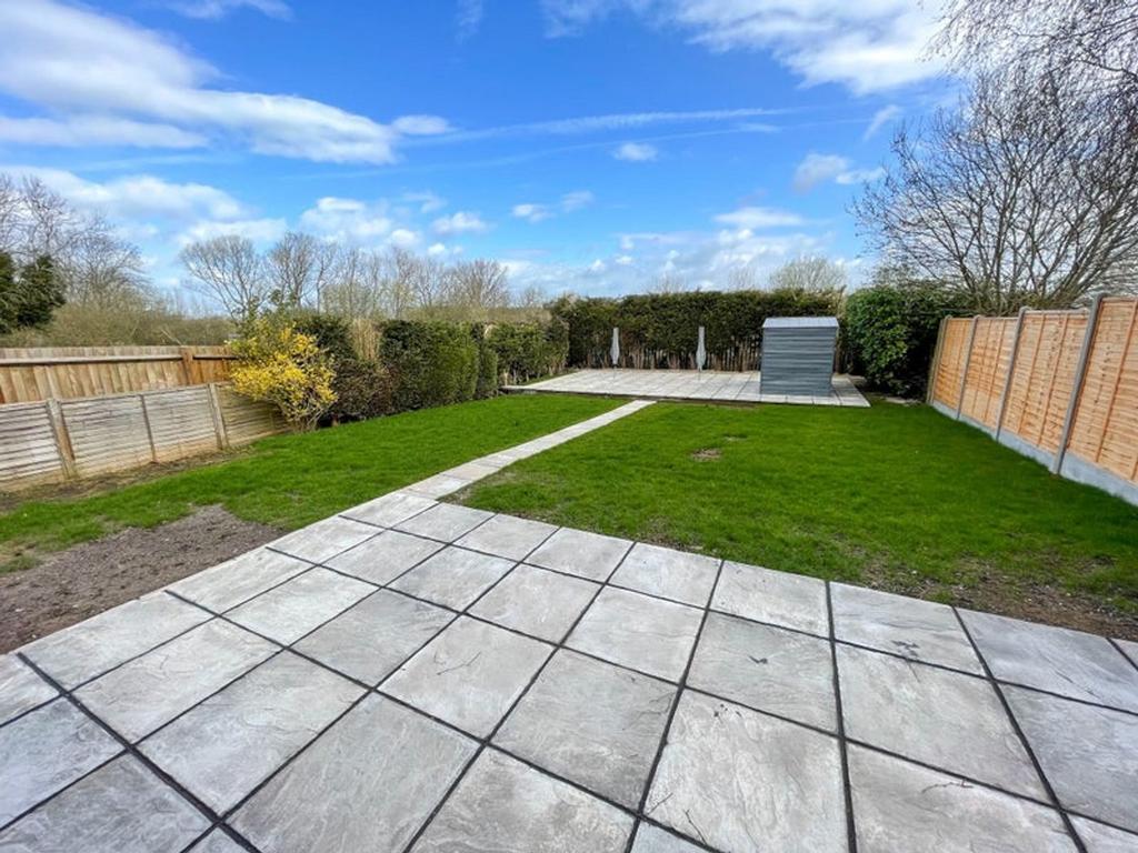 A spacious and well-maintained garden featuring...