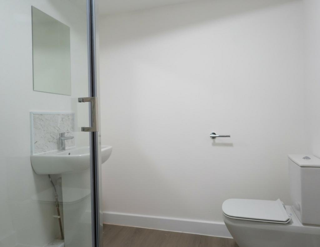 A modern and clean bathroom featuring a stylish...
