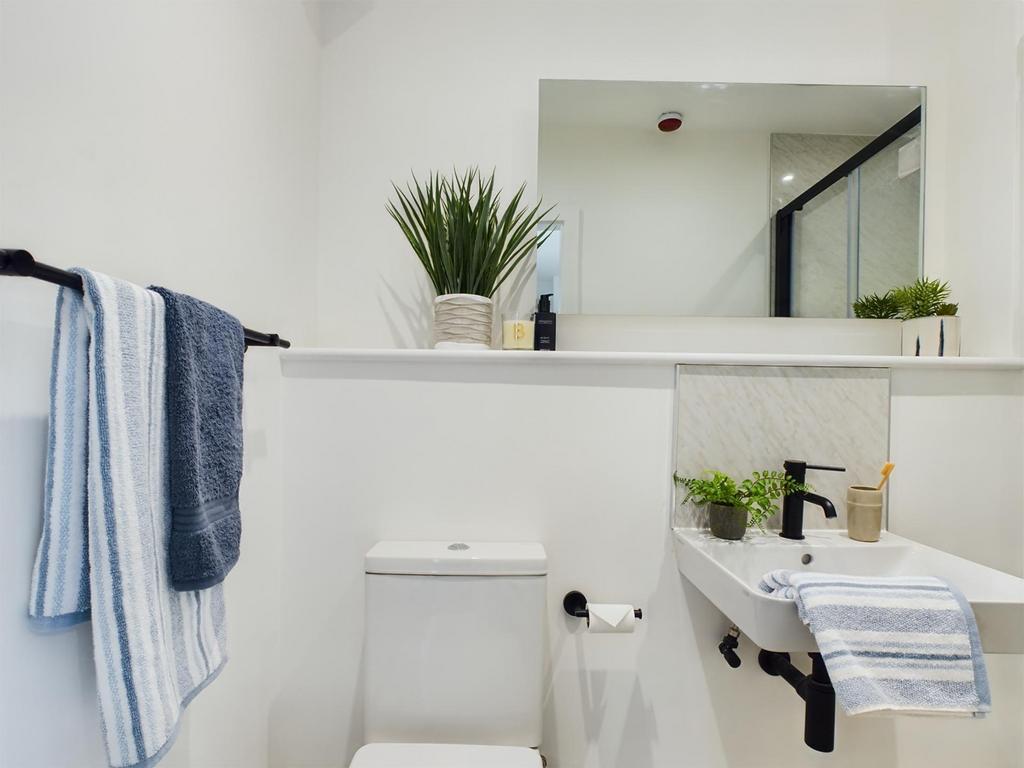 A bright and modern bathroom featuring stylish ...