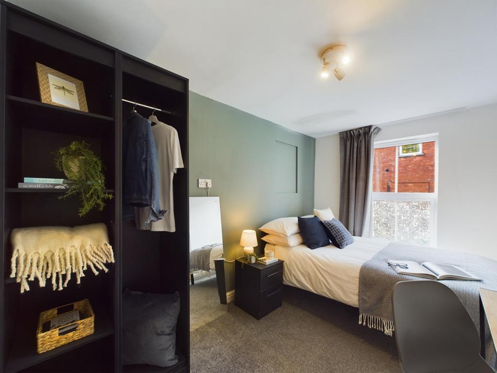 A spacious and well-maintained master bedroom f...