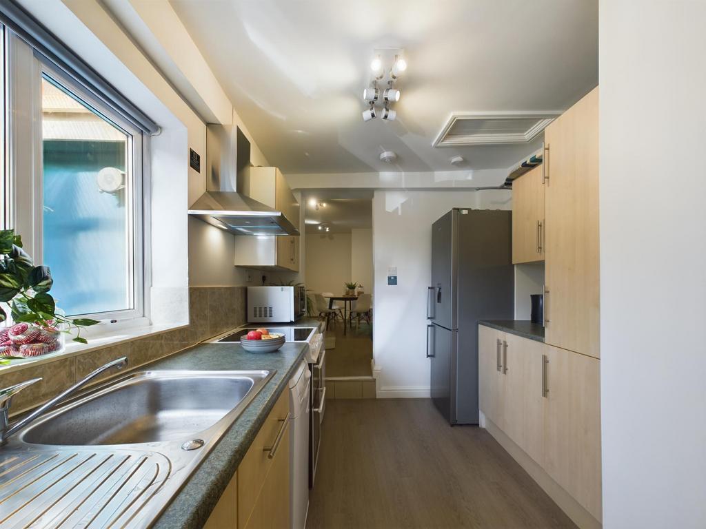 Bright and modern kitchen with ample natural li...