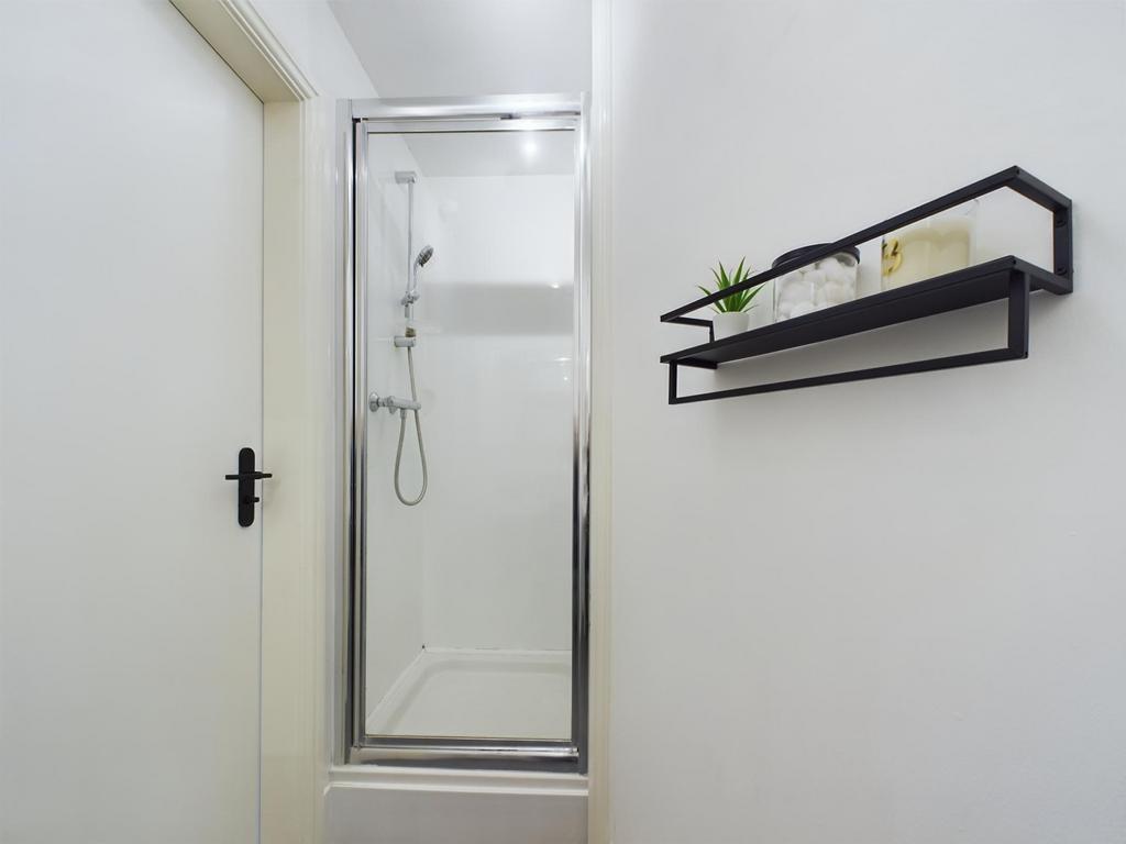 A clean and modern bathroom suite featuring a l...