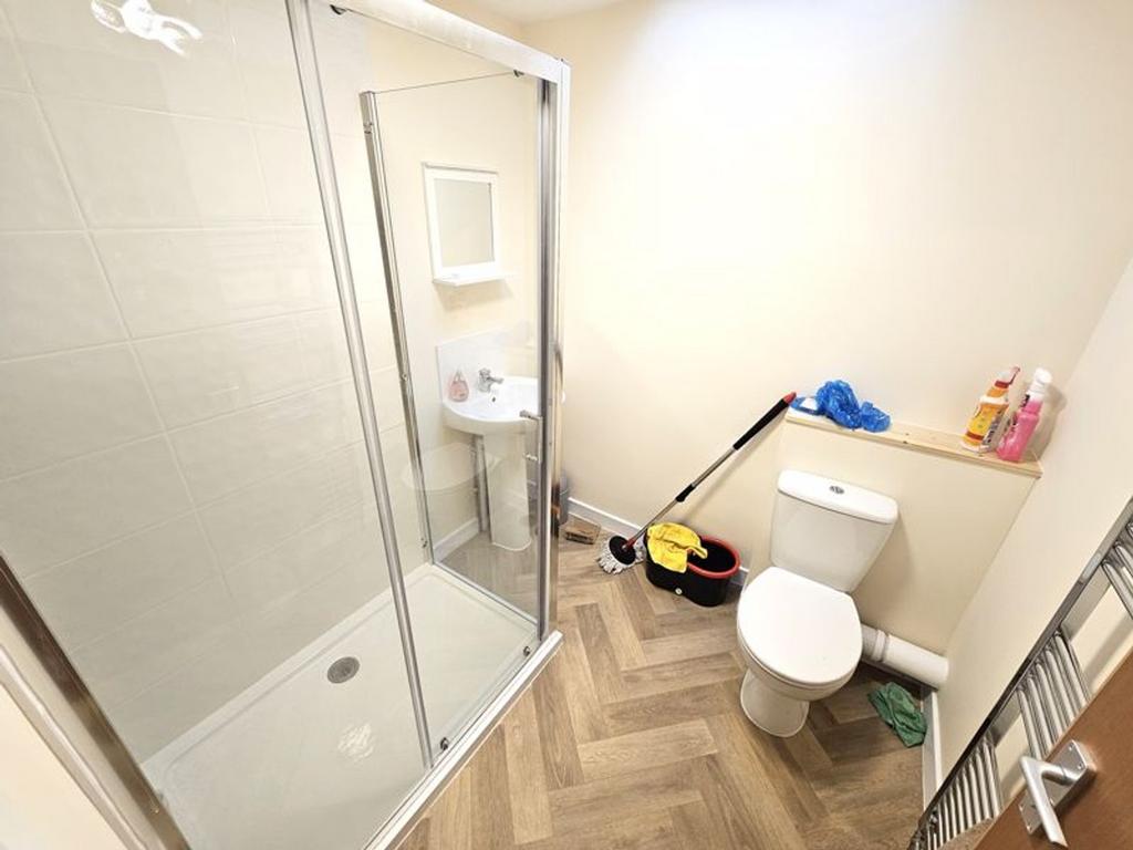 Bright and modern bathroom featuring a spacious...