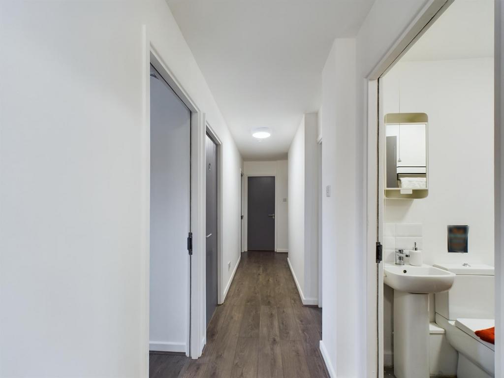 Bright, freshly painted hallway with modern woo...