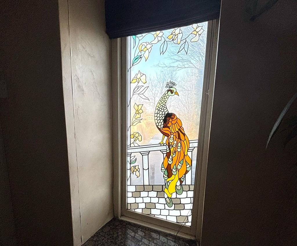 Tinted window near downstairs wc