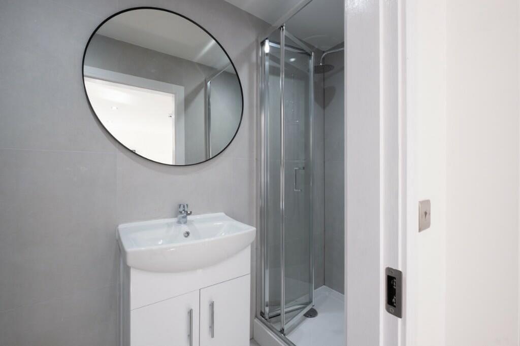 A modern and clean bathroom featuring a sleek d...
