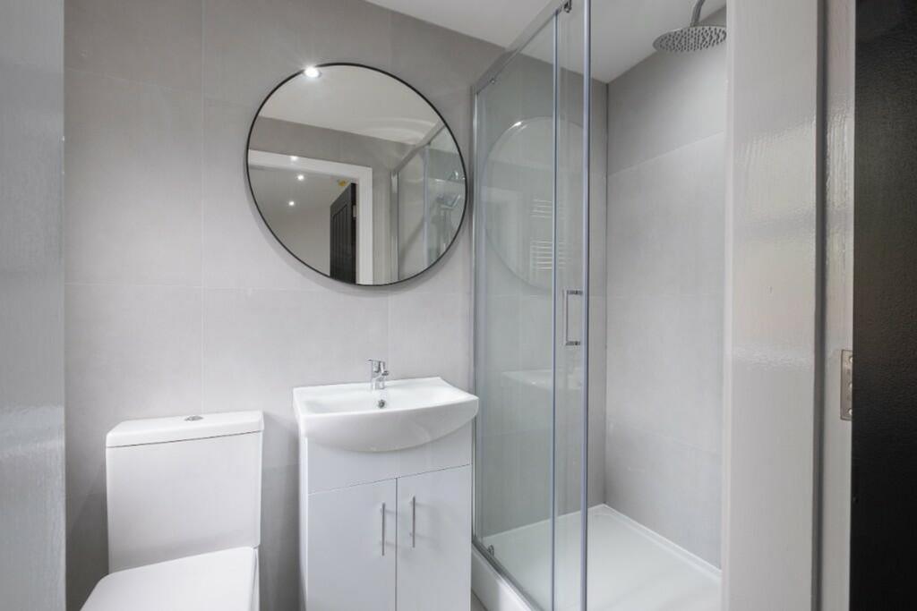 A modern and stylish bathroom featuring a sleek...
