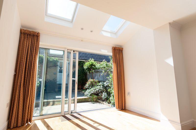 Conservatory interior, french doors leading to garden