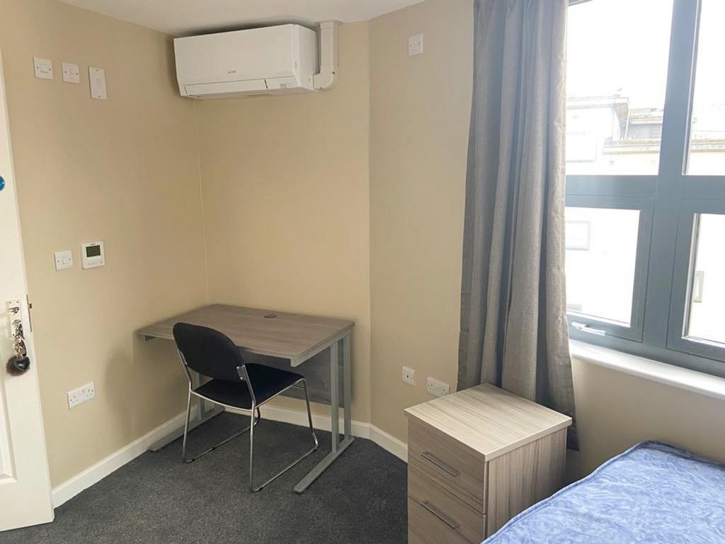 Bright and inviting double bedroom featuring a ...