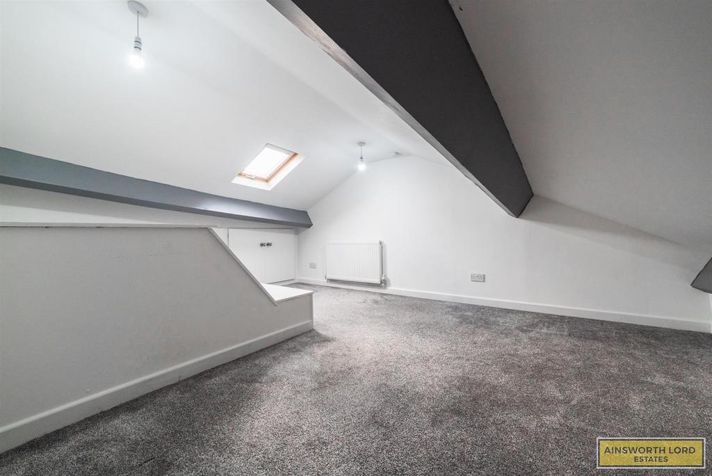 Attic room with cupboard storage