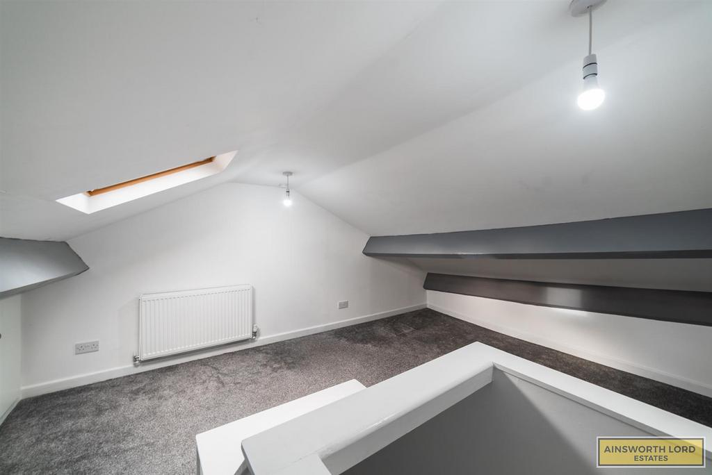 Attic room with cupboard storage