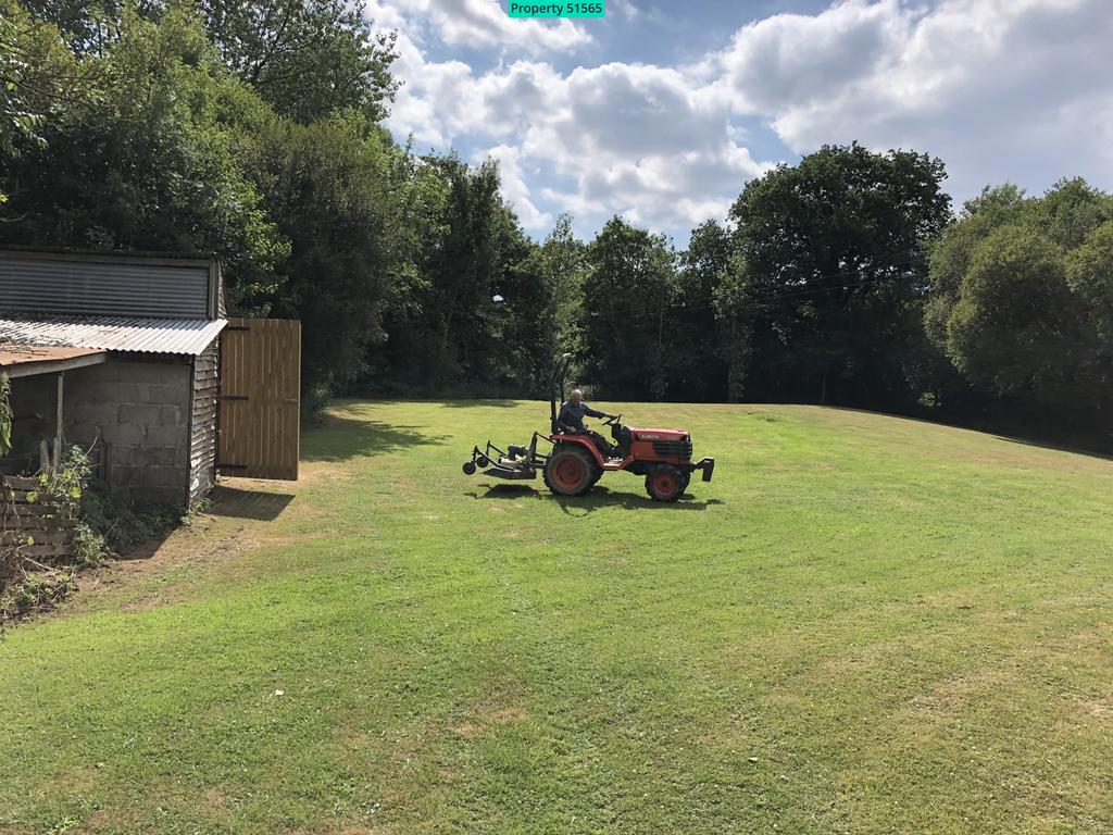 Meadow with large barn
