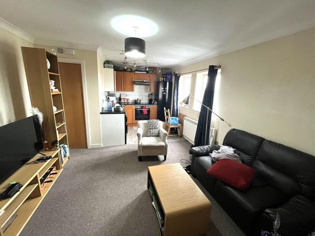 A cozy living room featuring a comfortable seat...