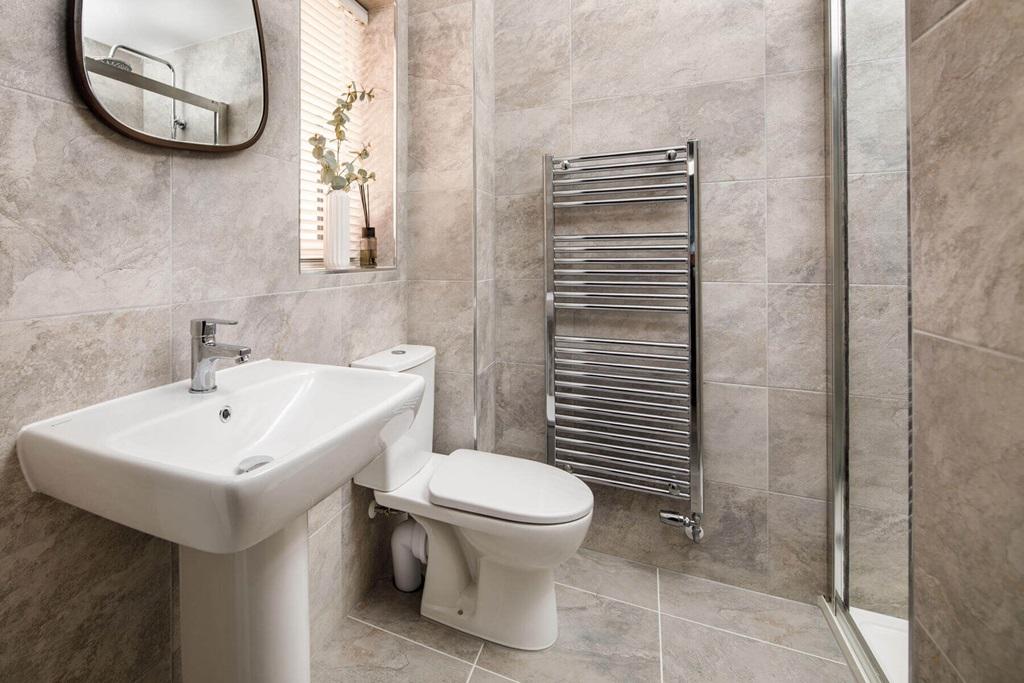 The main bedroom also hosts a private en-suite...