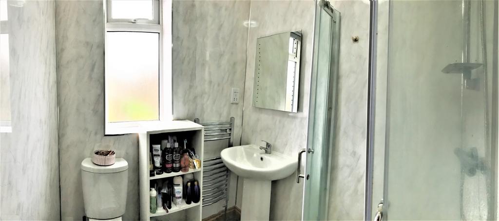 A well-maintained bathroom featuring modern fix...