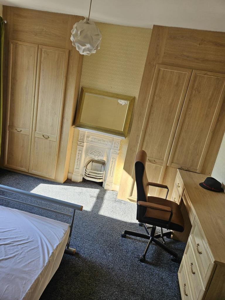 This charming double bedroom features ample nat...