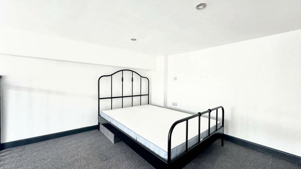 A spacious and bright double bedroom, perfect f...