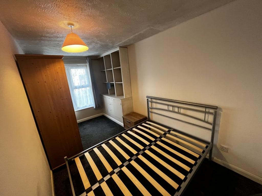 Inviting double bedroom featuring ample natural...