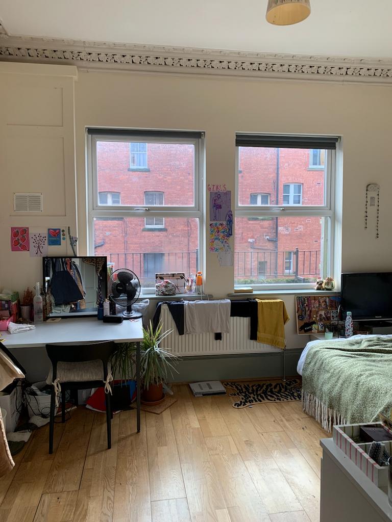 A bright and spacious double bedroom with large...