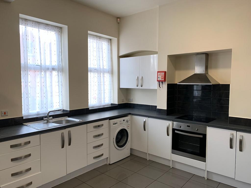 A bright and clean kitchenette featuring modern...