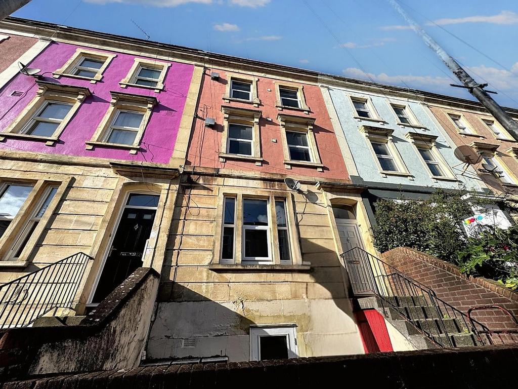 Charming front view of a vibrant terraced prope...