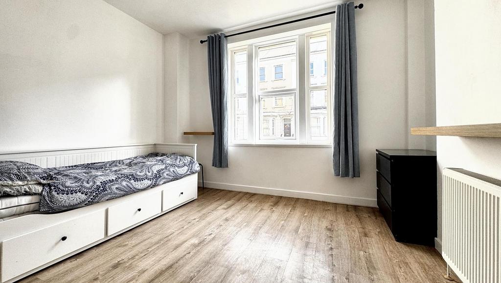 Bright and inviting double bedroom featuring la...