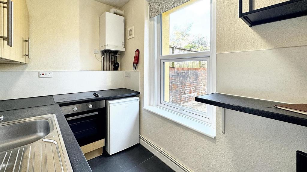This charming kitchen features modern appliance...