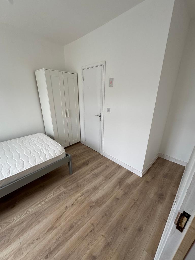 A bright and inviting double bedroom featuring ...