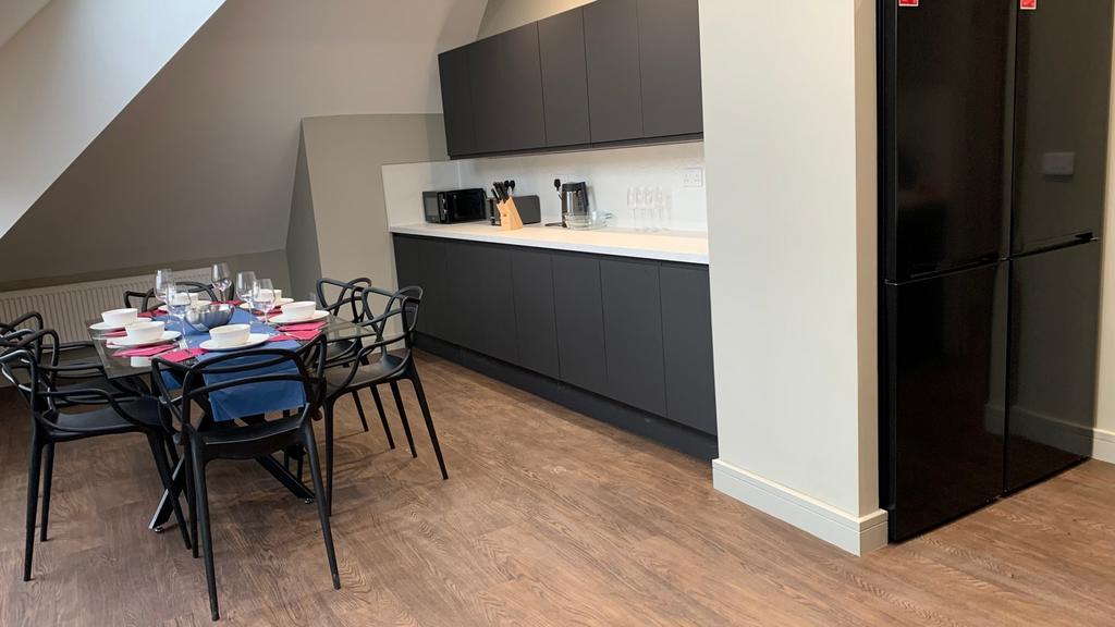 A modern kitchenette with ample space and great...