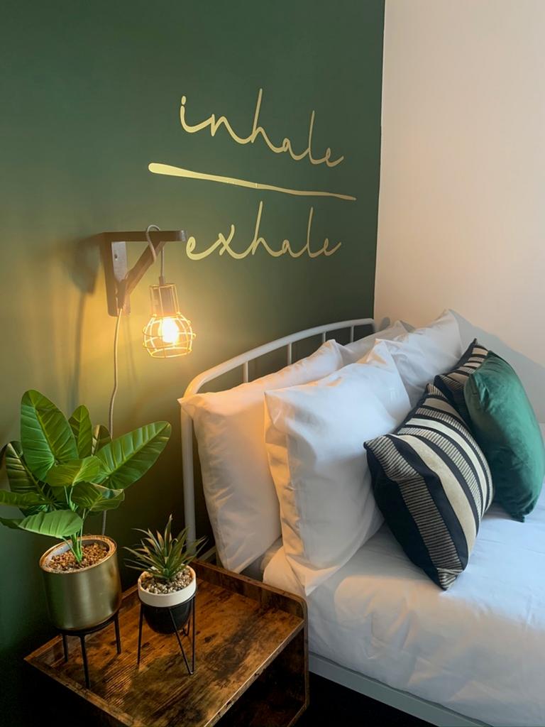 A stylish and inviting double bedroom with a mo...
