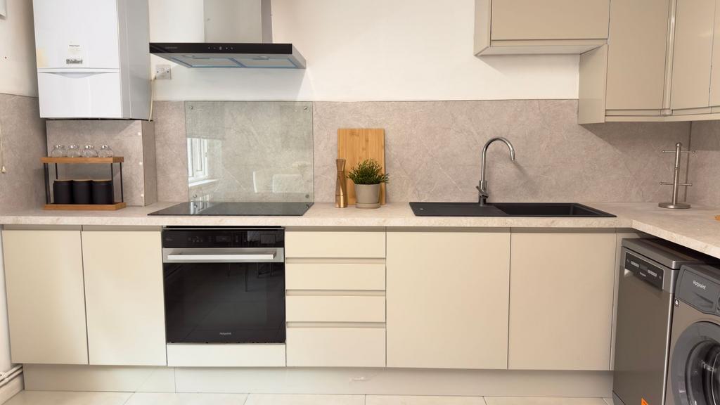 Modern, clean kitchen with ample counter space,...