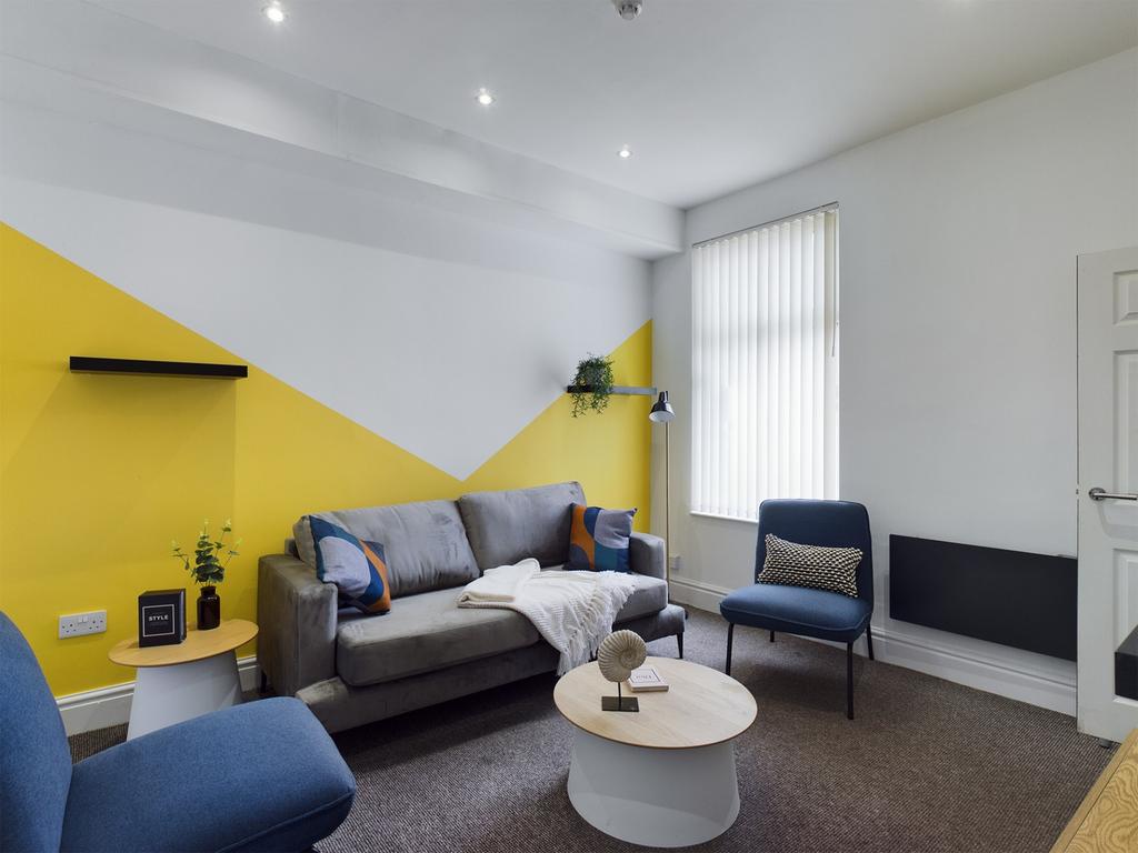 A bright and inviting large modern living room,...
