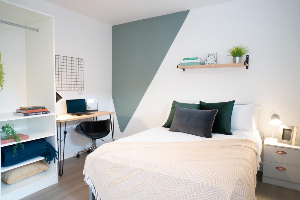 A bright and inviting double bedroom featuring ...