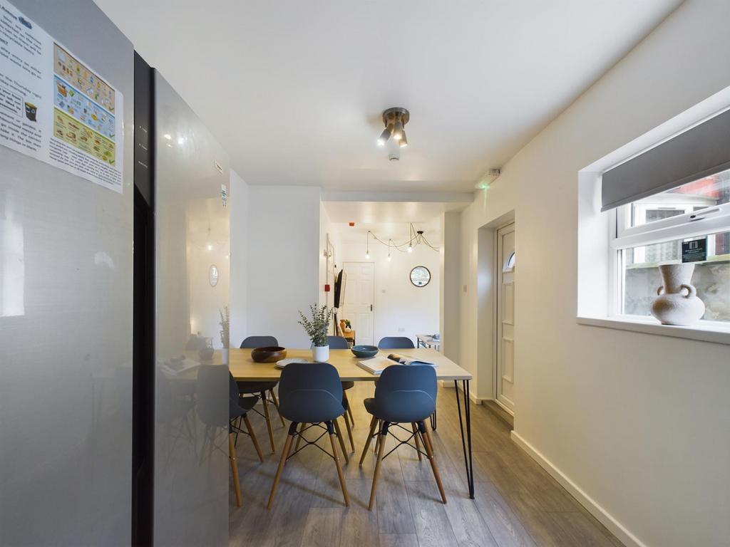 A modern and inviting kitchenette with a spacio...